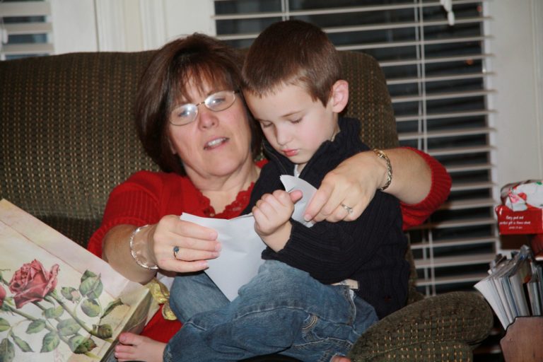 Grandma opening Christmas presents